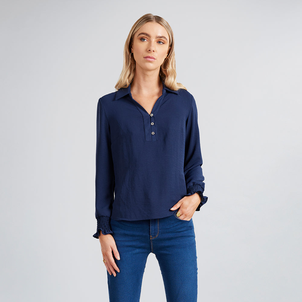 
                      
                        Blusa Puño Ruffle
                      
                    